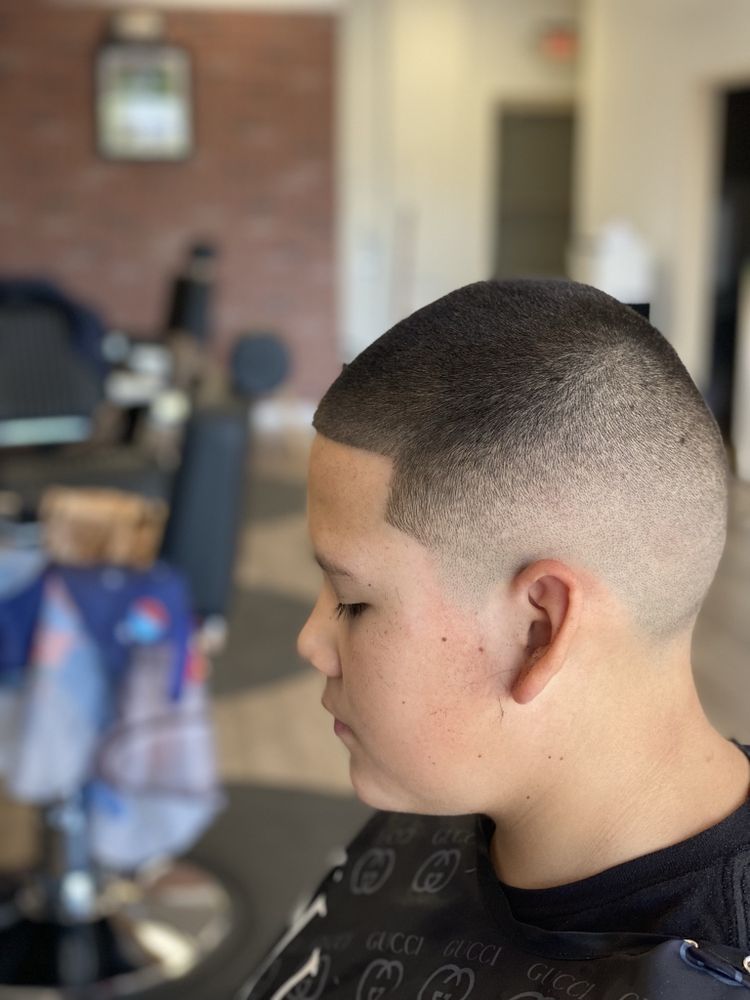 Kids' bald fade with a clean straight line-up, cut in Glendale, Arizona